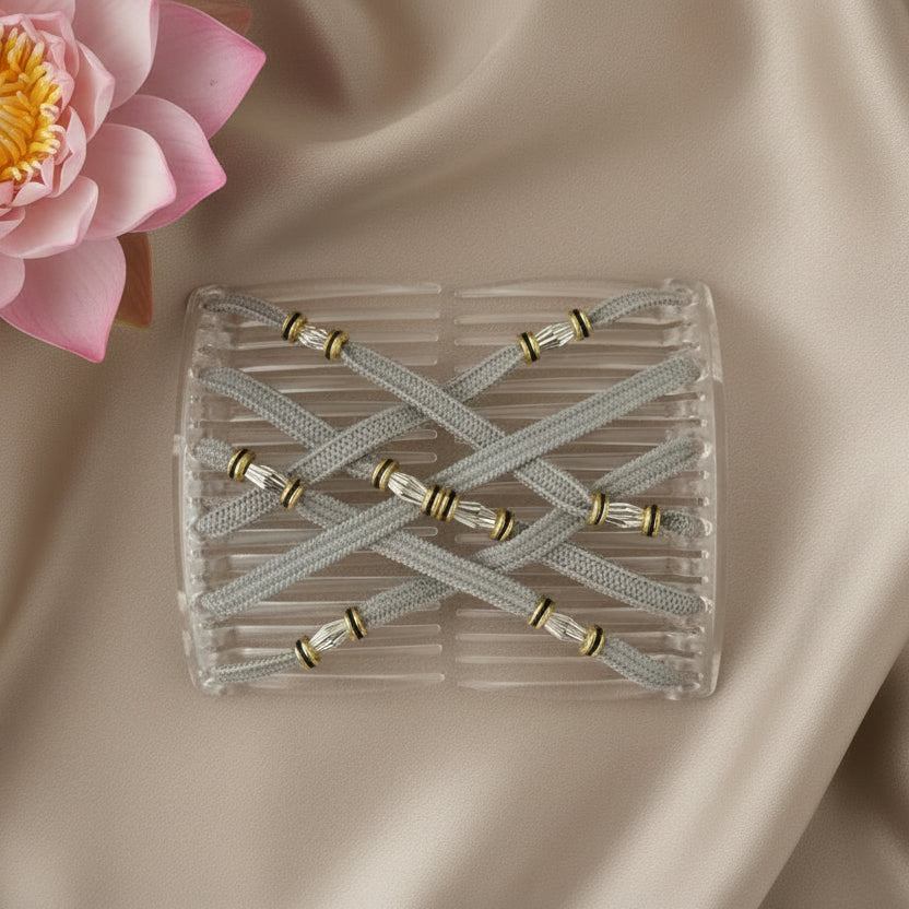 Peigne à cheveux artisanal transparent avec lanières grises croisées et ornements dorés cylindriques – Le peigne N°971